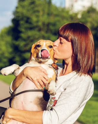 Woman hugging dog